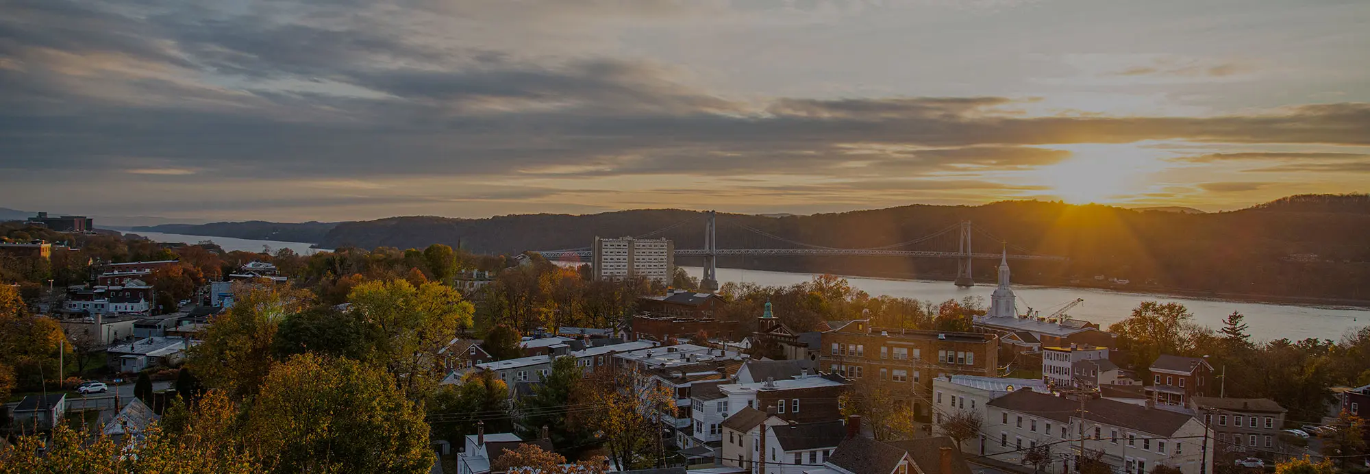 An aerial view of the city of Poughkeepsie at sunset.